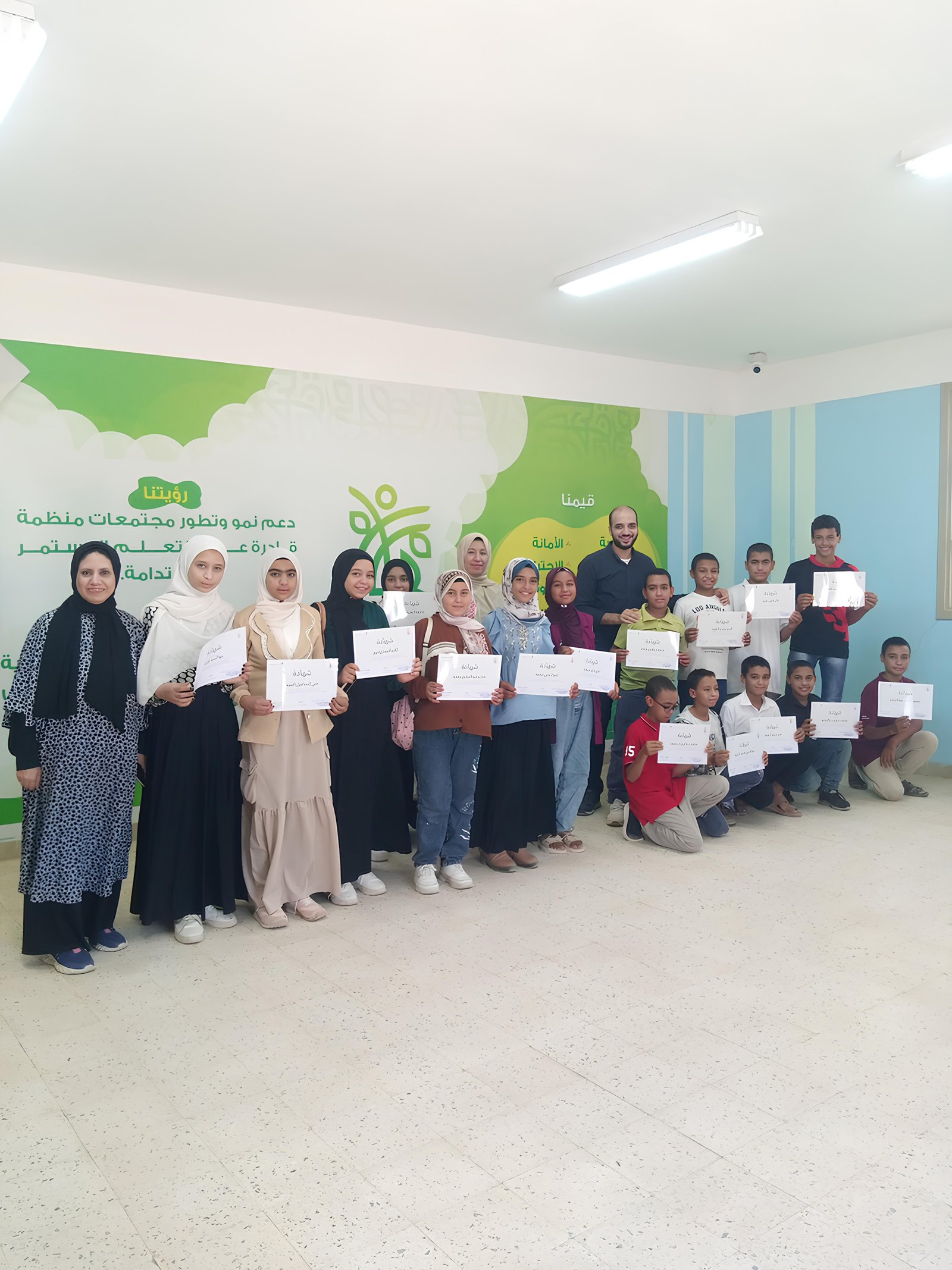 AI Camp in Sohag, Egypt — participants holding certificates